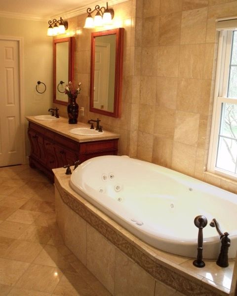 Master bathroom with walk-in shower and marble tile