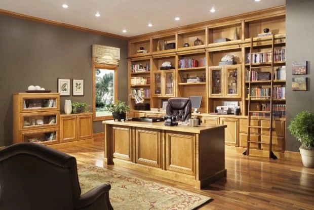Home office with built-in cabinetry and shelving