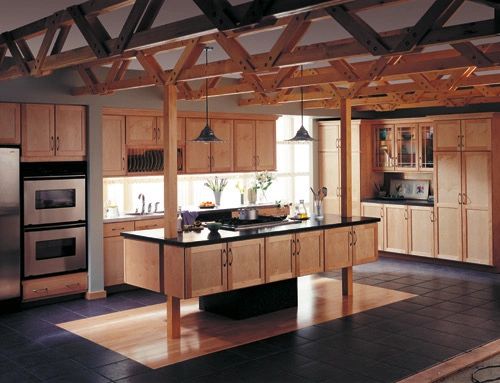 Basement kitchen and bar area with wood cabinetry and stone